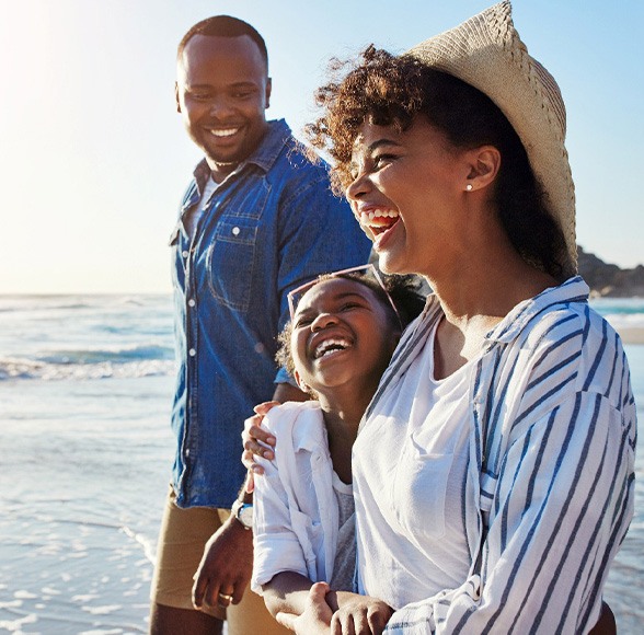 Invisalign patient in Williamstown at beach with family