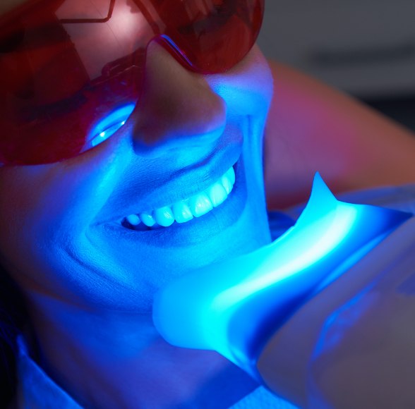 Patient receiving in office teeth whitening