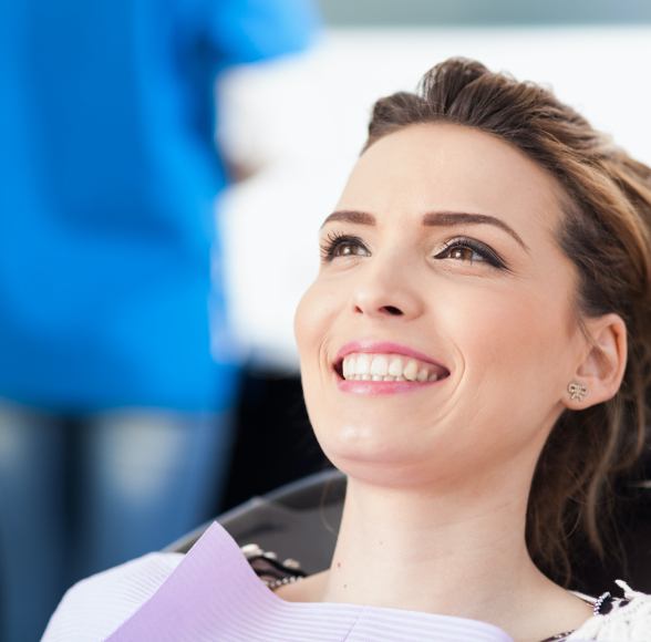 Woman in dental chair smiling