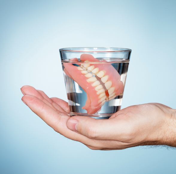 Full dentures in a glass of water