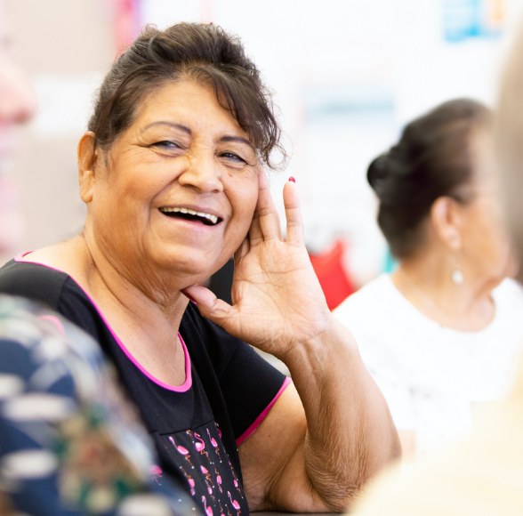 Woman with new dentures smiling