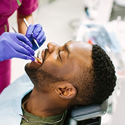 Emergency dentist in Williamstown looking at patient's teeth