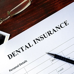 Dental insurance paperwork lying on desk