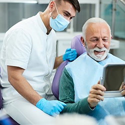 Patient smiling next to emergency dentist in Williamstown