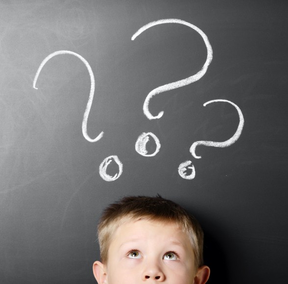 Child with question marks around his head
