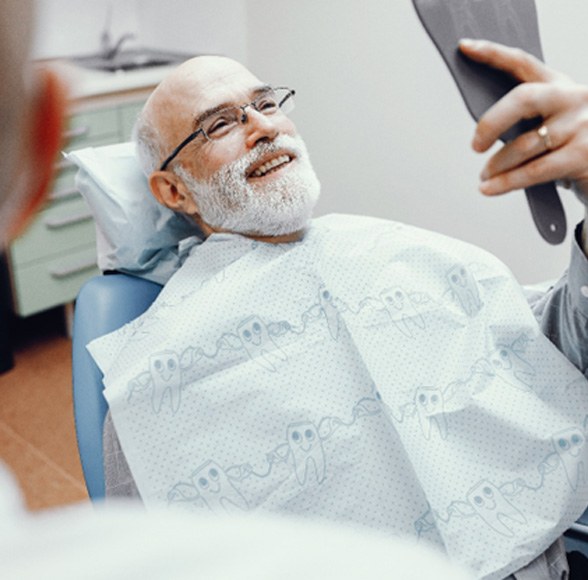 Man smiling after dental implant salvage in Williamstown