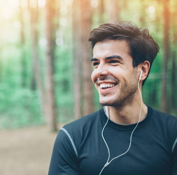 Young man smiling after Invisalign