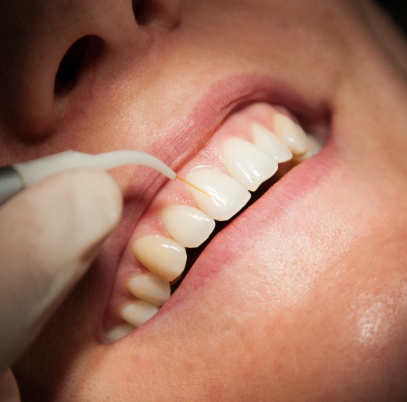 Patient receiving soft tissue laser therapy