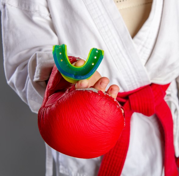 Young person holding a sportsguard