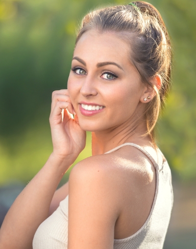 Young woman with healthy smile after preventive dentistry