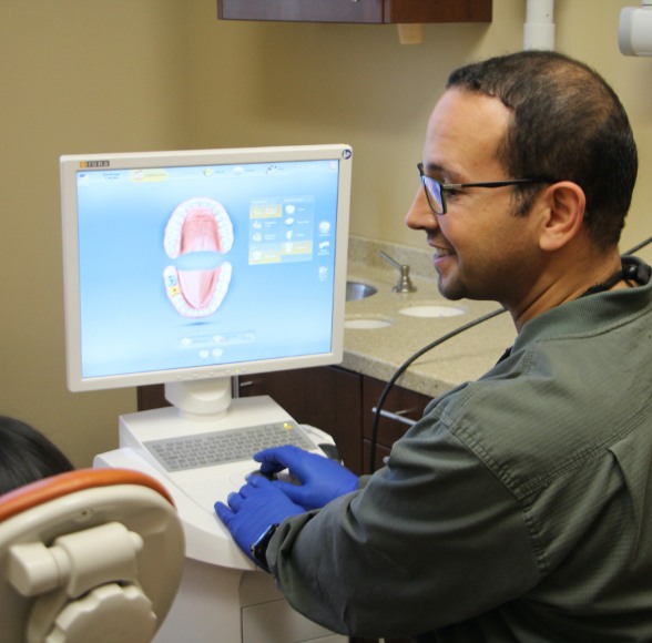 Dental insurance dentist smiling at dental patient