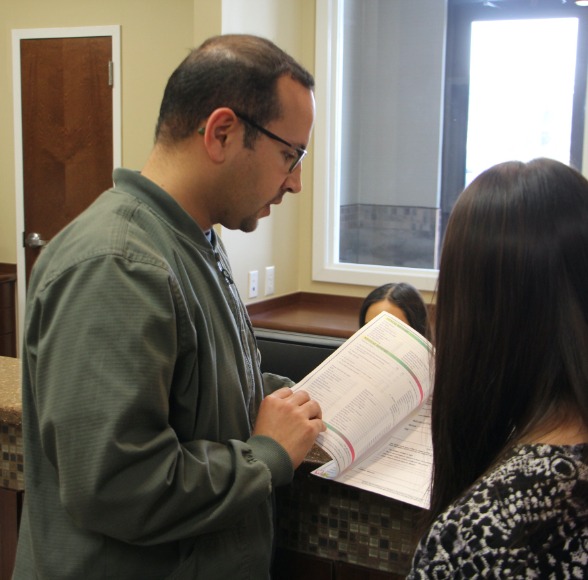 Dentist and patient discussing dental care