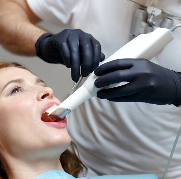 Dentist using intraoral camera to capture images