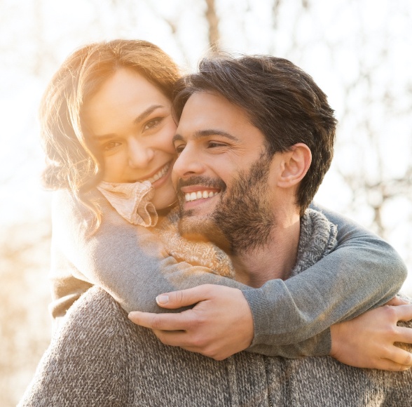 Man and woman with tooth colored fillings smiling together