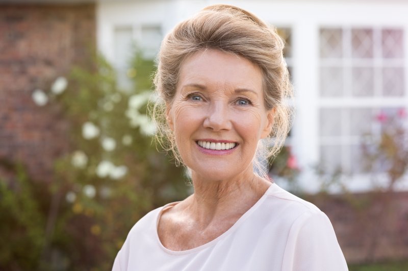 older woman smiling with nice teeth