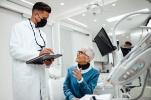 a patient during their dental implant consultation