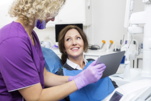 a patient attending their dental implant consultation