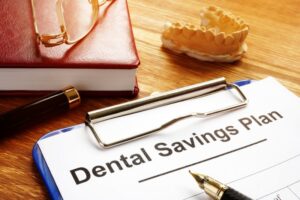 clipboard that says “dental savings plan” 