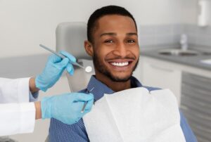 Man smiling in a dental office
